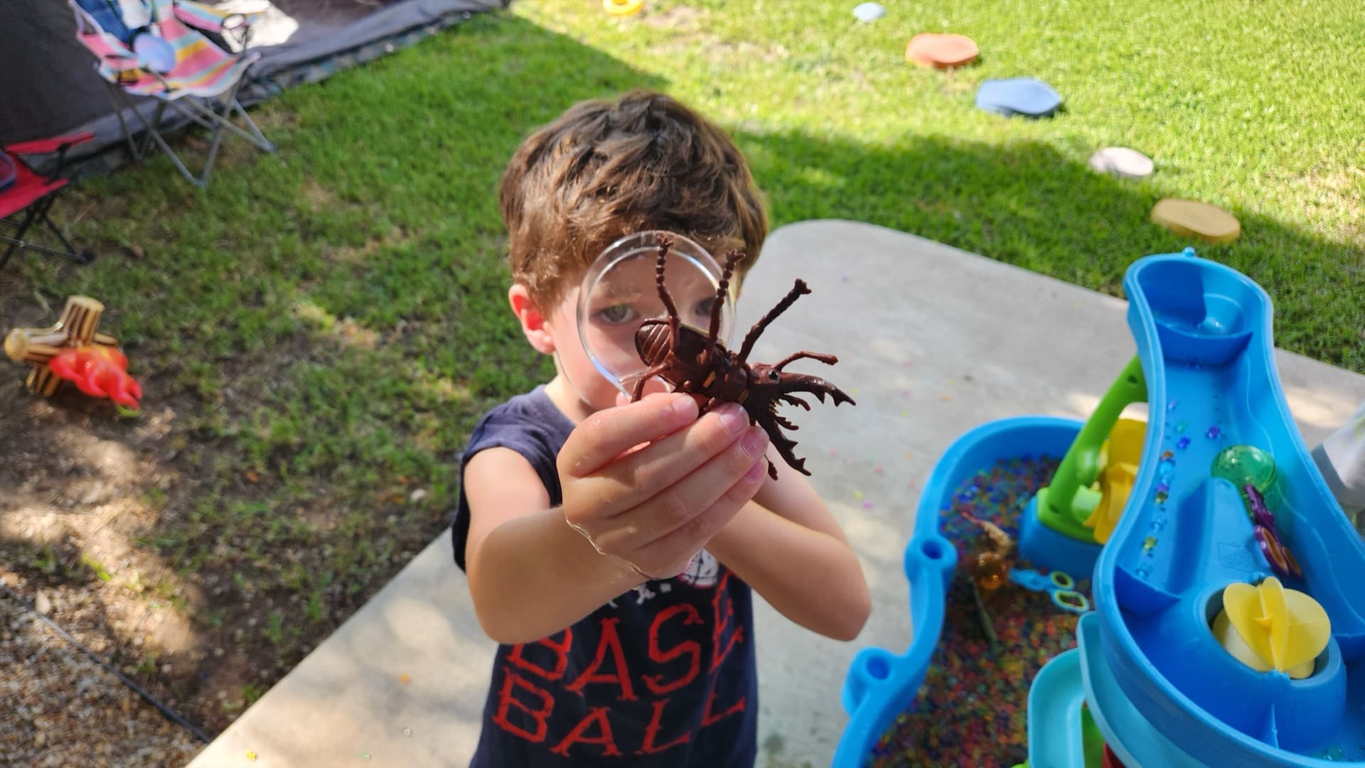 Child reading in the grass